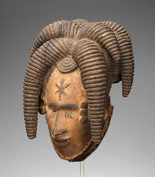 Agbogho mmuo (maiden spirit) face mask, Igbo artist, Wood, pigment, cloth, wire, thread, applied organic material, Igbo peoples