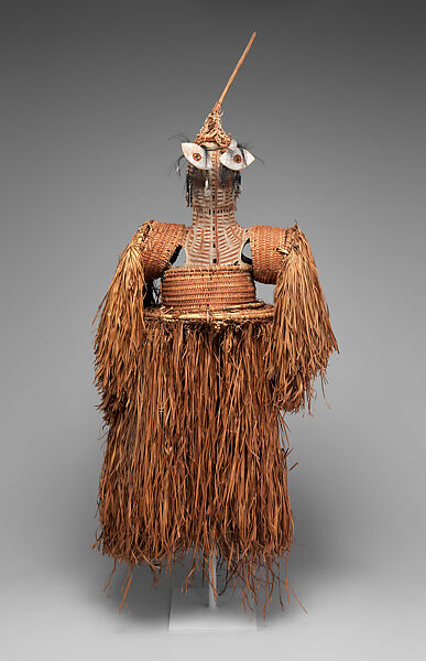 Body mask, Asmat artist, Mulberry fiber, rattan, sago palm leaves, wood, bamboo, cassowary bone, cassowary feathers, feathers, coix seeds, pigment, Asmat people