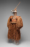 Body mask, Asmat artist, Mulberry fiber, rattan, sago palm leaves, wood, bamboo, cassowary bone, cassowary feathers, feathers, coix seeds, pigment, Asmat people