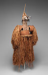Body mask, Asmat artist, Mulberry fiber, rattan, sago palm leaves, wood, bamboo, cassowary bone, cassowary feathers, feathers, coix seeds, pigment, Asmat people