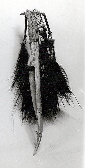 Dagger, Crocodile jawbone, cassowary feathers, cassowary quills, fiber, seeds, Asmat people 