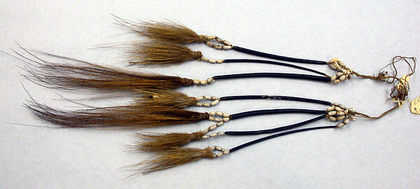 Tassels, Cassowary feathers, cassowary quills, seeds, fiber, Asmat people 