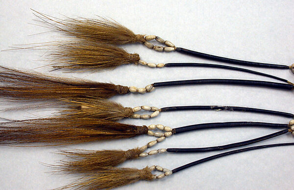 Tassels, Cassowary feathers, cassowary quills, seeds, fiber, Asmat people