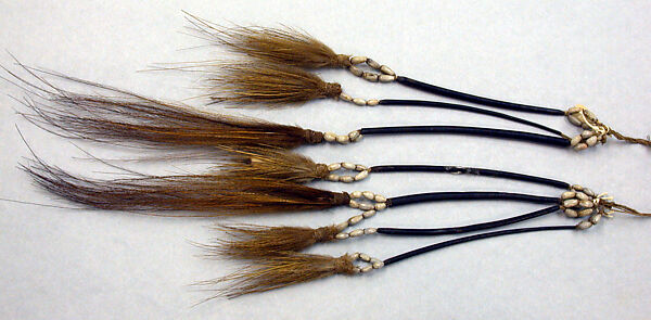 Tassels, Cassowary feathers, cassowary quills, seeds, fiber, Asmat people 