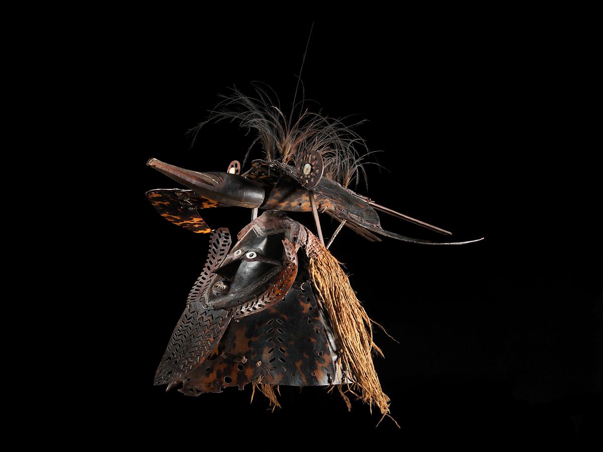Krar (mask), Mabuiag Island artist, Turtle shell, wood, cassowary feathers, fiber, resin, shell, paint, Torres Strait Islander