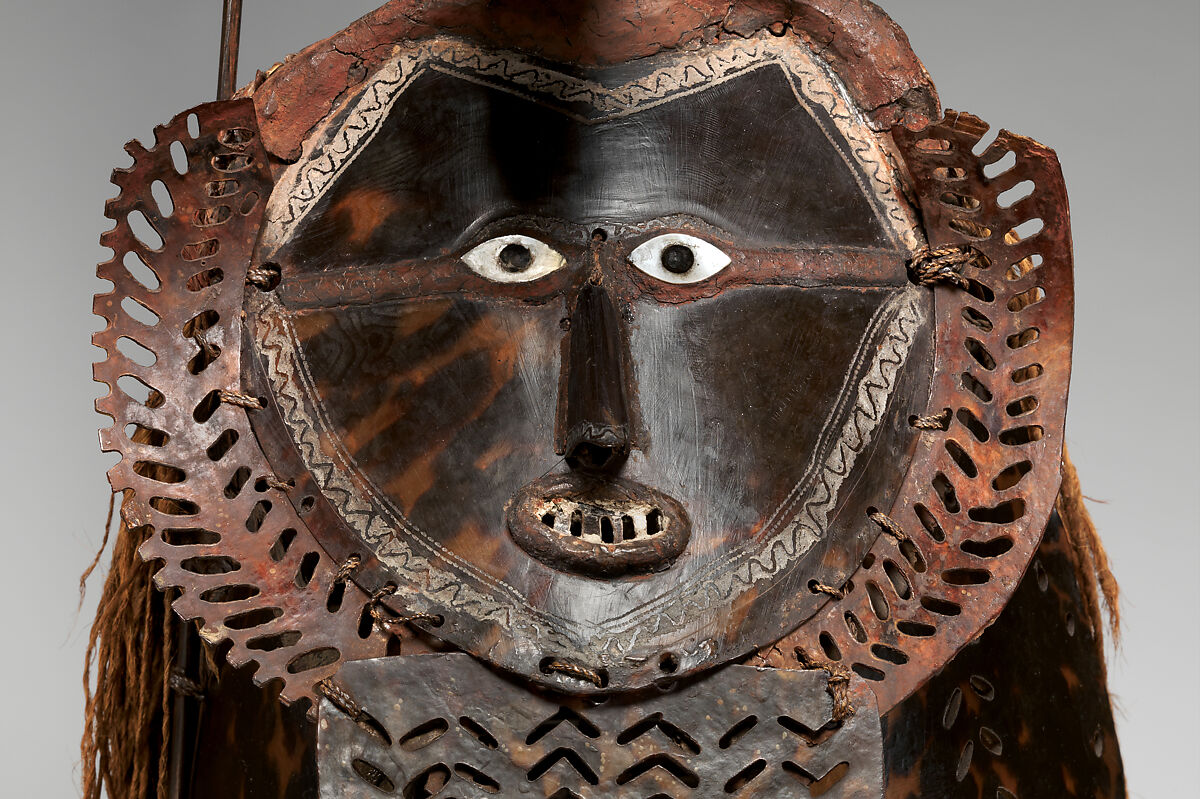 Krar (mask), Mabuiag Island artist, Turtle shell, wood, cassowary feathers, fiber, resin, shell, paint, Torres Strait Islander