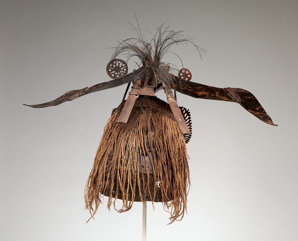 Krar (mask), Mabuiag Island artist, Turtle shell, wood, cassowary feathers, fiber, resin, shell, paint, Torres Strait Islander