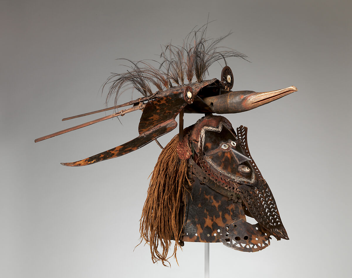 Krar (mask), Mabuiag Island artist, Turtle shell, wood, cassowary feathers, fiber, resin, shell, paint, Torres Strait Islander