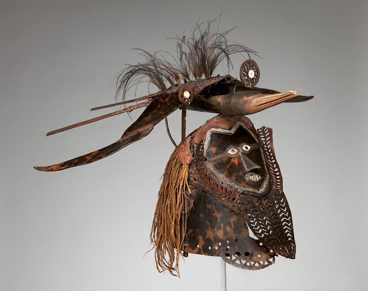 Krar (mask), Mabuiag Island artist, Turtle shell, wood, cassowary feathers, fiber, resin, shell, paint, Torres Strait Islander