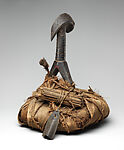 Reliquary, Kota artist, Wood, cane, pigment, raffia palm, leaves, copper alloy, resin, primate skull, spire shell, Kota peoples