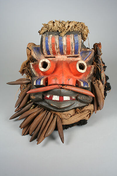 Mask, Wood, tin, cord, cloth, fiber, nails, cartridges, human hair, Guere peoples 