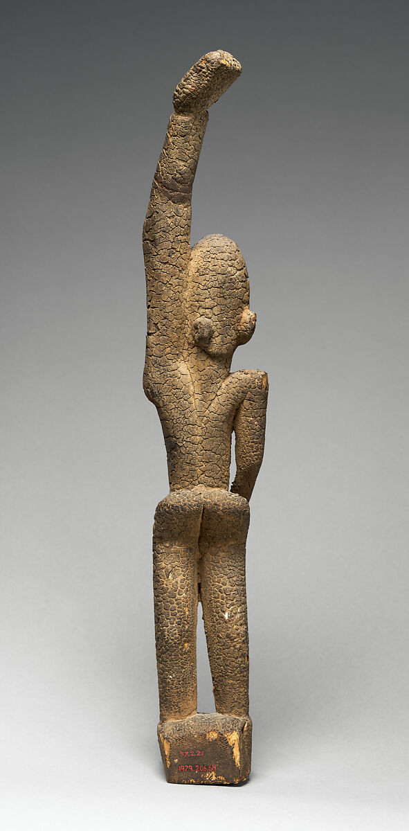 Female figure with raised arm, Tellem blacksmith, Wood (Moraceae family), applied organic materials, Tellem civilization (?)