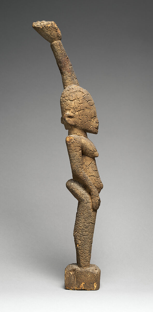 Female figure with raised arm, Tellem blacksmith, Wood (Moraceae family), applied organic materials, Tellem civilization (?)