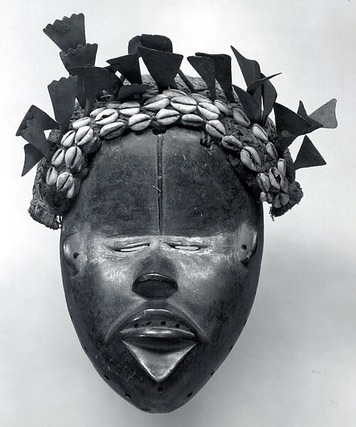 Face Mask, Wood, iron, raffia, cowries, pigment, clay, Dan peoples 