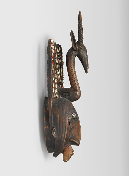 Mask: Antelope Figure (Ntomo), Wood, pigment, cowrie shells, seeds, latex, metal, Bamana peoples