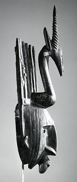 Mask: Antelope Figure (Ntomo), Wood, pigment, cowrie shells, seeds, latex, metal, Bamana peoples