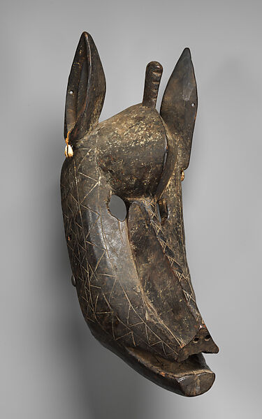 Suruku koun (hyena) mask, Bamana numuw (blacksmith), Wood, cowrie shells, pigment, Bamana peoples 