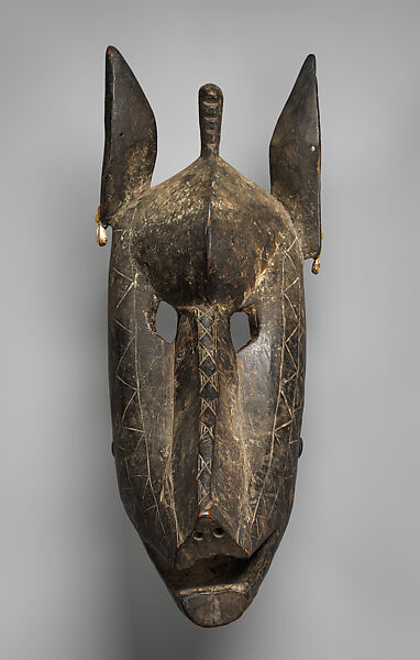 Suruku koun (hyena) mask, Bamana numuw (blacksmith), Wood, cowrie shells, pigment, Bamana peoples 