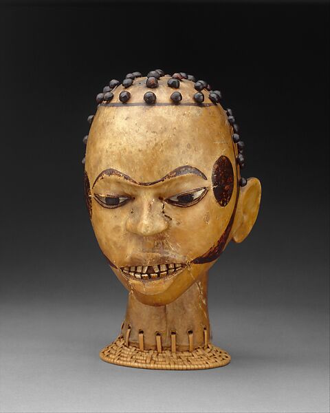 Yoruba Ekoi (Ejagham): Ekoi wooden masks are covered with animal skin.  These figures usually refer