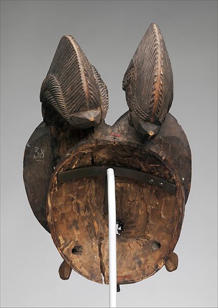 Nda (twin) face mask from a mblo performance, Baule artist, Wood, metal, patina stain, Baule peoples