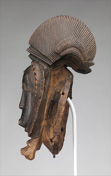 Nda (twin) face mask from a mblo performance, Baule artist, Wood, metal, patina stain, Baule peoples