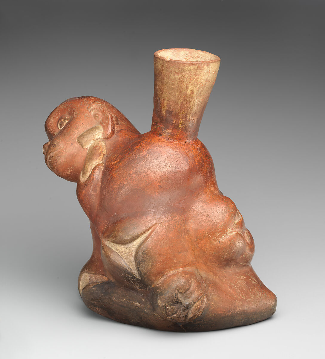 Tuber-inspired stirrup-spout bottle with monkeys, Moche artist(s), Ceramic, slip, Moche