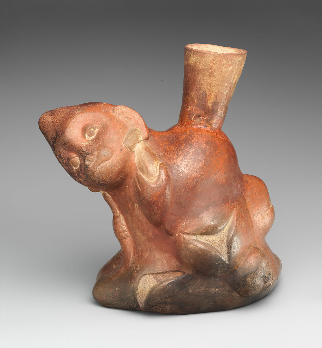 Tuber-inspired stirrup-spout bottle with monkeys, Moche artist(s), Ceramic, slip, Moche 