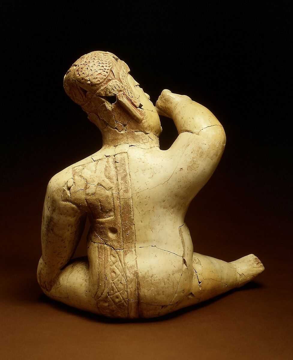 Seated hollow figure with helmet, Las Bocas artist(s), Ceramic, cinnabar, red ochre, Olmec