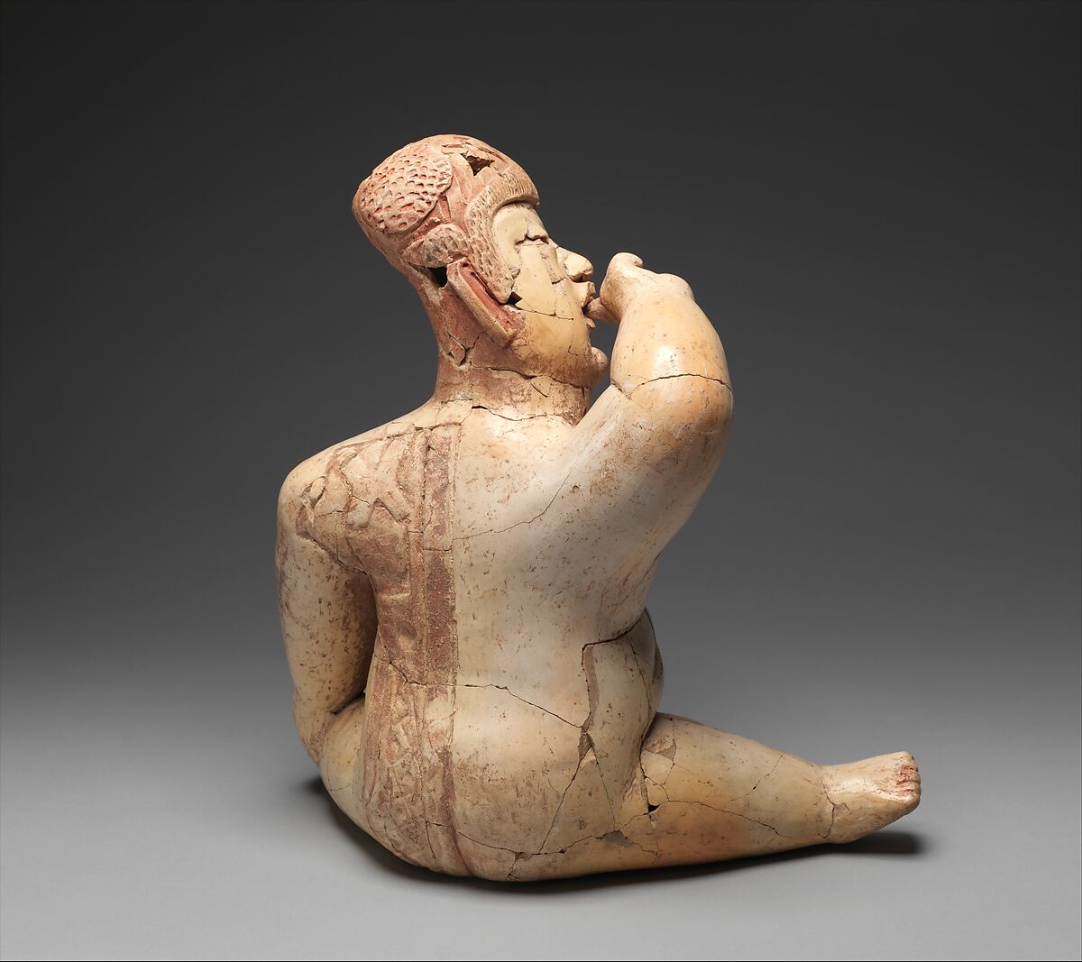 Seated hollow figure with helmet, Las Bocas artist(s), Ceramic, cinnabar, red ochre, Olmec