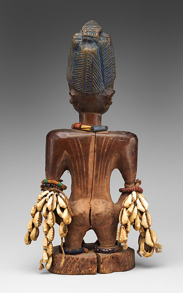 Ibeji Twin Figure, Oyo-Yoruba artist, Wood, camwood powder, brass, glass beads, cowries, blueing, string, Oyo-Yoruba peoples