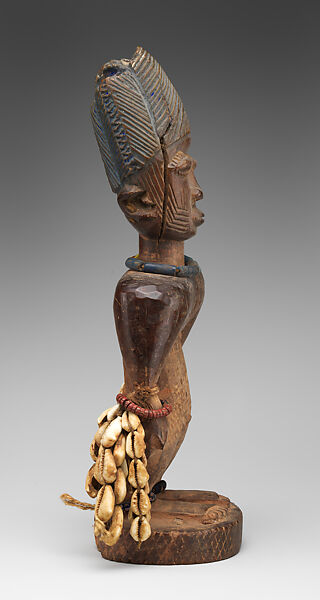 Ibeji Twin Figure, Oyo-Yoruba artist, Wood, camwood powder, brass, glass beads, cowries, blueing, string, Oyo-Yoruba peoples