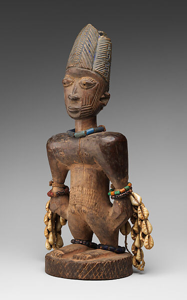 Ibeji Twin Figure, Oyo-Yoruba artist, Wood, camwood powder, brass, glass beads, cowries, blueing, string, Oyo-Yoruba peoples
