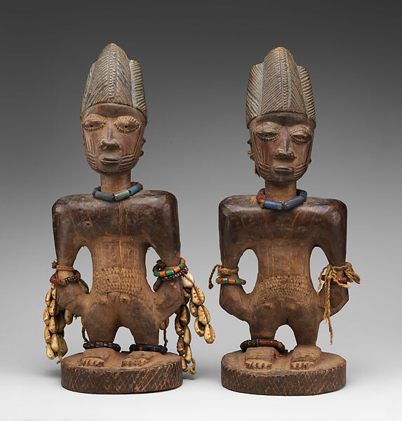 Twin Figure: Male (Ibeji), Oyo-Yoruba artist, Wood, camwood powder, brass, glass beads, cowries, blueing, string, Oyo-Yoruba peoples