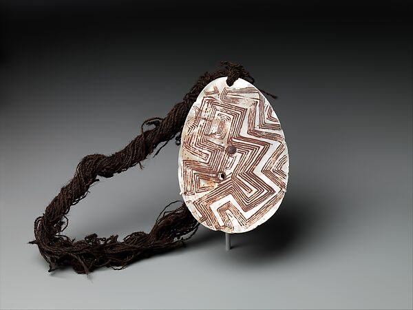 Riji, jakoli, or longkalongka (engraved pearl shell) with belt, Aboriginal artist, Pearl shell, human hair, ocher, Western Kimberley
