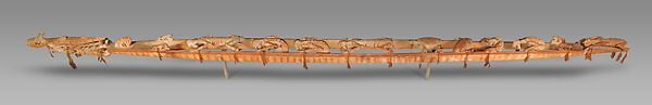 Wuramon (spirit canoe), Asmat artist(s), Wood, paint, sago palm leaves, seeds, cassowary feathers, Asmat peoples