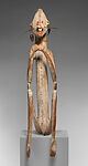 Male ancestor figure, Asmat artist, Wood, paint, sago palm leaves, fibers, mulberry fiber, pig tusk, cassowary quills, hair, coix seed, Asmat people