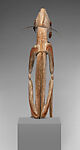 Male ancestor figure, Asmat artist, Wood, paint, sago palm leaves, fibers, mulberry fiber, pig tusk, cassowary quills, hair, coix seed, Asmat people