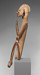 Male ancestor figure, Asmat artist, Wood, paint, sago palm leaves, fibers, mulberry fiber, pig tusk, cassowary quills, hair, coix seed, Asmat people