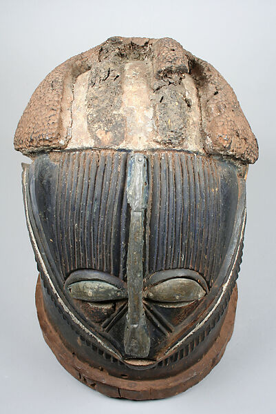 Helmet Mask (Odumado), Igala or Okpoto artist, Wood, metal strips, resin, pigment, Igala or Okpoto peoples
