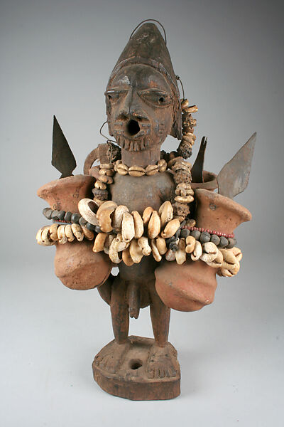 Figure: Male with Vessels, Wood, terracotta, iron, seeds, cowries, beads, wire, Fon peoples 