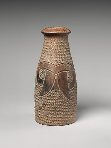 Bottle with fang motif