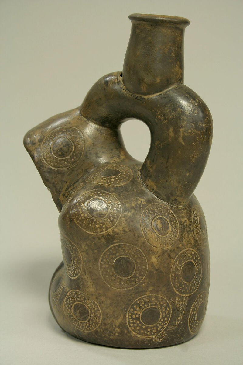Stirrup Spout Bottle; Kneeling Figure, Ceramic, pigment, Cupisnique