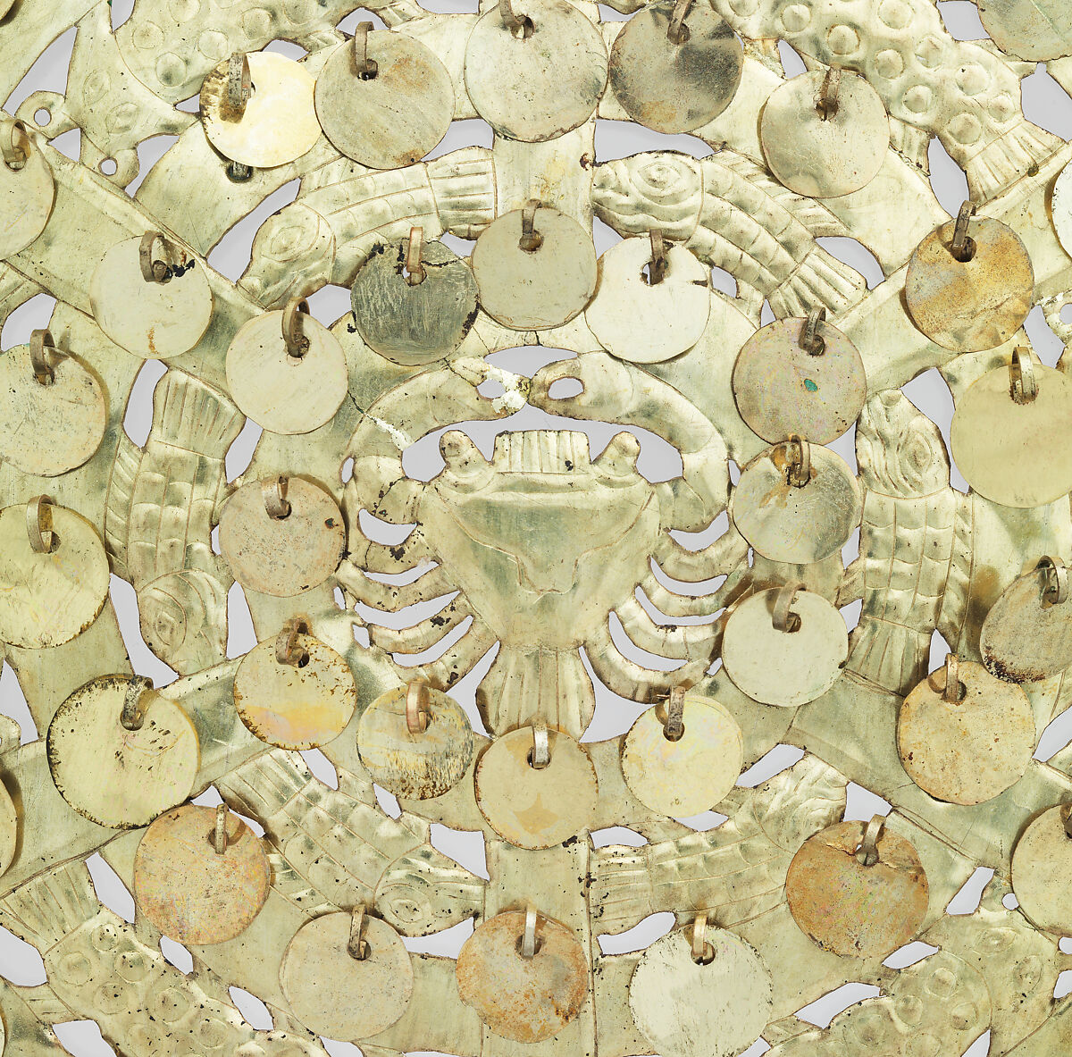 Shield with crab and fish figures, Moche artist(s), Gilded copper, Moche