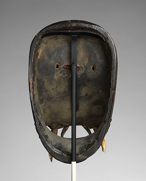 Kagle face mask, Dan artist, Wood, brass tacks, nails, dried mud, animal teeth, hair, and paint, Dan peoples