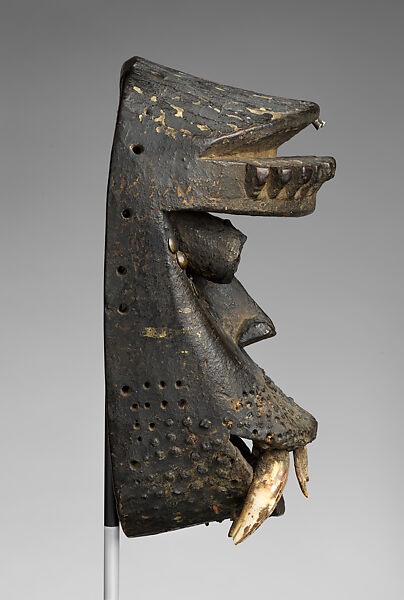Kagle face mask, Dan artist, Wood, brass tacks, nails, dried mud, animal teeth, hair, and paint, Dan peoples