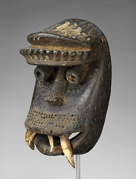 Kagle face mask, Dan artist, Wood, brass tacks, nails, dried mud, animal teeth, hair, and paint, Dan peoples