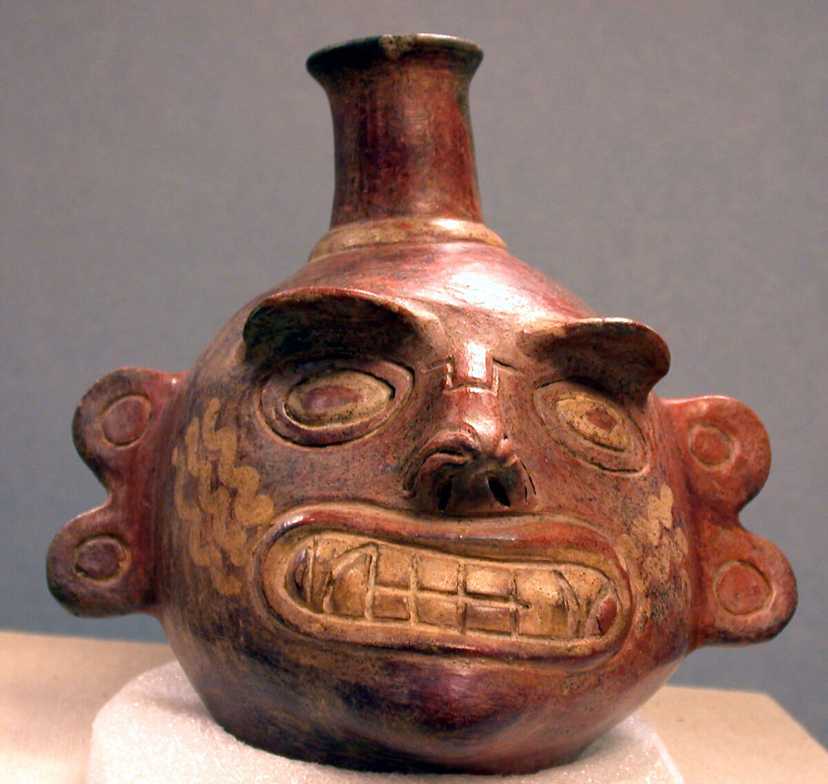 Single Spout Bottle with Fanged Face, Ceramic, Vicús