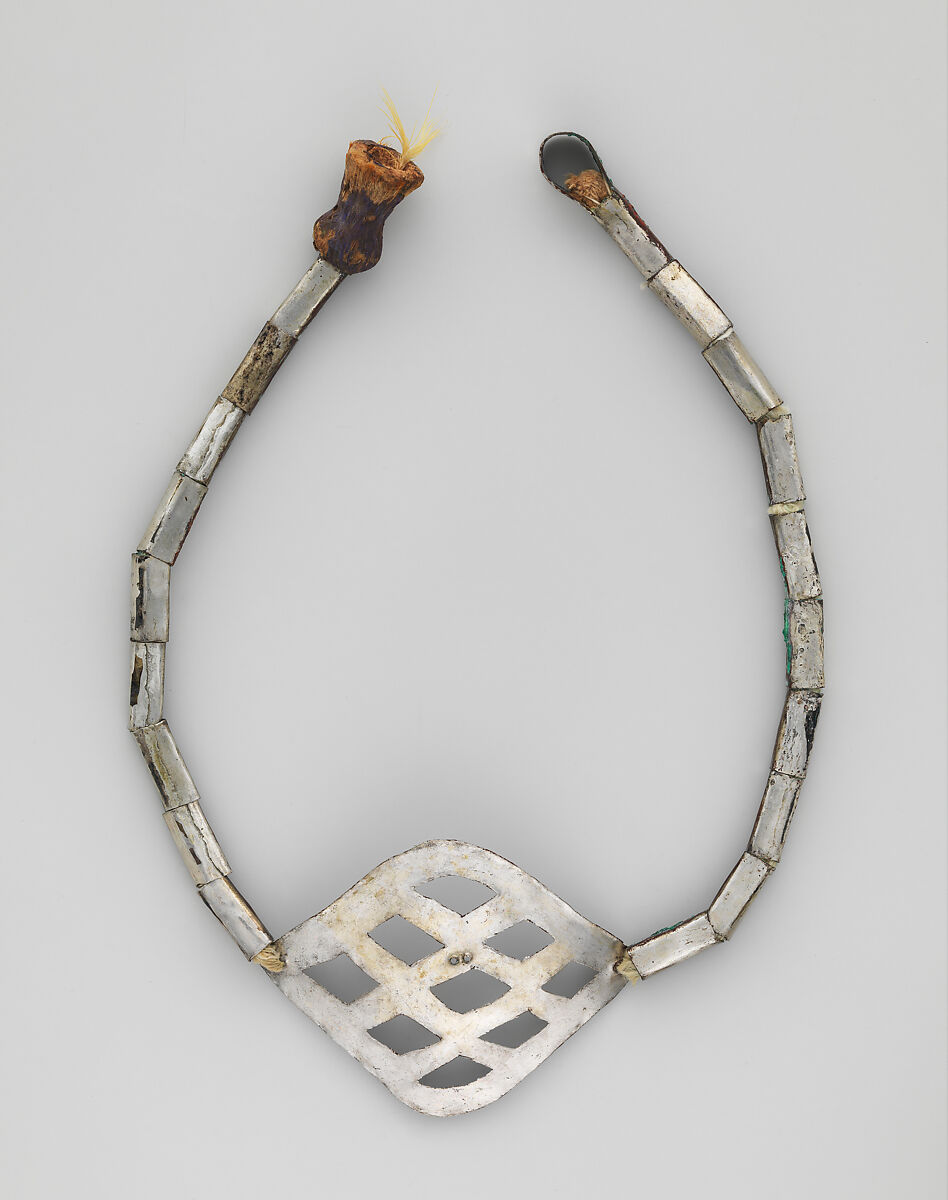 Miniature slingshot, Chimú or Chancay artist(s), Silver (hammered), feathers, wood, Chimú or Chancay 