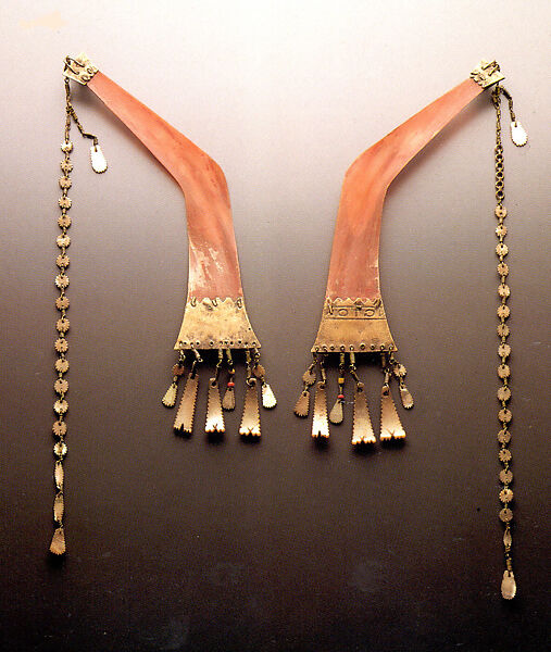 Batling (men’s ear ornaments), Ilongot artist, Hornbill ivory, metal, pearl shell, glass beads, Ilongot people