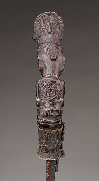 Piso sanalenggam (sword), Toba Batak artist, Water buffalo horn, copper/zinc alloy (sun inlay and end of the handle), lead (necklace and eyes of the handle figure), iron alloy, Toba Batak